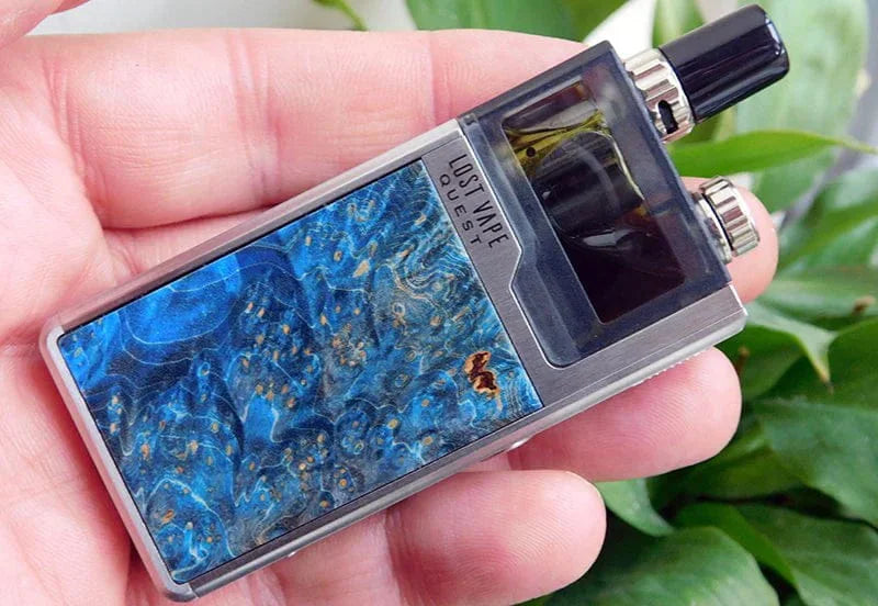 Hand holding a Lost Vape Orion electronic device with blue marbled design